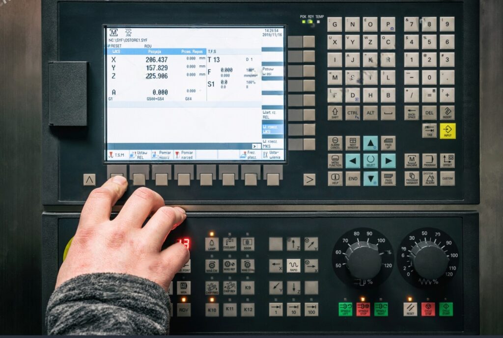 Man working on cnc programming